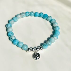 Glass bead bracelet with charm